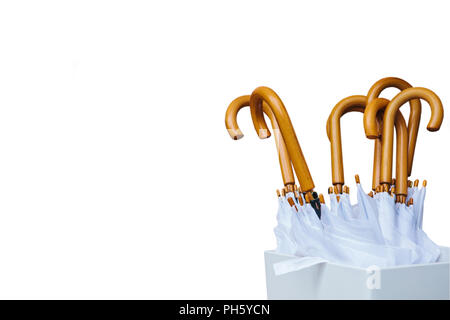 A set of white modern umbrellas on a white background. Stock Photo