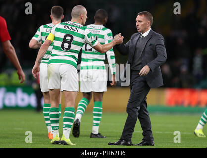 Celtic's Scott Brown and manager Brendan Rodgers after the UEFA Europa League Play-Off, Second Leg match at Celtic Park, Glasgow. Stock Photo