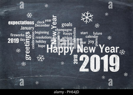 Happy New Year 2019 word cloud - white chalk text  on a blackboard, a greeting card Stock Photo