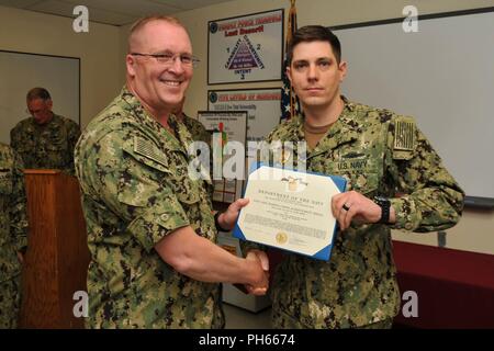 U.S. Air Force Capt. Jesse Prater, left, and Maj. Micah Yost, 351st Air ...