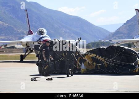 The U.S. Special Operations Command The Para-Commandos parachute demonstration team member lands on the ramp during the Warriors Over the Wasatch Air and Space Show June 24, 2018, at Hill Air Force Base, Utah. The Para-Commandos are comprised of active duty special operators, such as Army Special Forces, Army Rangers, Navy SEALs, Air Force Combat Controllers and Marine Raiders. Stock Photo