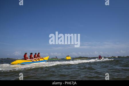 Hurlburt youth head out on a banana boat ride during Freedom Fest, June 22, 2018, at Hurlburt Field, Florida. Freedom Fest is an annual event designed to build resilience at Hurlburt Field, the most deployed base in the U. S. Air Force, by focusing on family and friends while celebrating the nation’s independence. Stock Photo