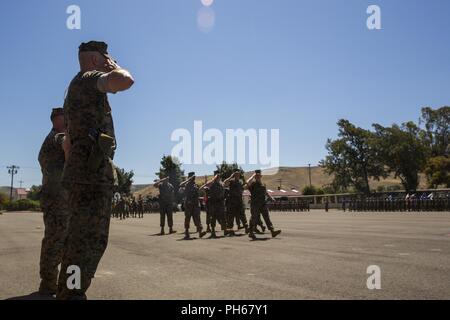 U.S. Marines with 2nd Battalion, 11th Marine Regiment, 1st Marine Division, participate during a change of command ceremony at Marine Corps Base Camp Pendleton, Calif., June 21, 2018. The change of command ceremony represented the official passing of authority from the offgoing commander, Lt. Col Patrick F. Eldridge, to the incoming commander, Lt. Col. Caleb Hyatt. Stock Photo