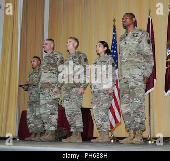 Brig. Gen. Jeffrey J. Johnson, Commanding General, U.S. Army Regional Health Command-Central, and Command Sgt. Maj. Michael L. Gragg, Command Sergeant Major, U.S. Army Medical Command present Army Commendation Medals for meritorious achievement to Sgt. Joshua Meyers and Sgt. Beatrice Clark, NCO and Soldier 2018 MEDCOM Best Warrior Competition winners, during an awards presentation June 28, 2018, on Fort Sam Houston, Texas. The BWC is an annual week-long event Soldiers on their physical and mental capabilities. The top NCO and Soldier will move on to compete in the Army-wide BWC at Fort A.P. Hi Stock Photo