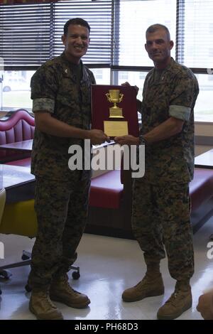 CAMP COURTNEY, OKINAWA, Japan – Students from the local community talk with  Marines during Camp Courtney's Summer English class Aug. 16 at the Camp  Courtney Mess Hall, Okinawa, Japan. This weeklong class