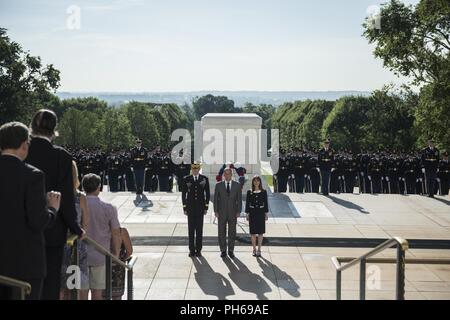 U.S. Army Maj. Gen. Michael Howard (left), commanding general, U.S. Army Military District of Washington; Gerald O’Keefe (center), Administrative Assistant to the Secretary of the Army; and O’Keefe’s wife (right) participate in an Army Full Honors Wreath-Laying at the Tomb of the Unknown Soldier at Arlington National Cemetery, Arlington, Virginia, June 29, 2018. Stock Photo