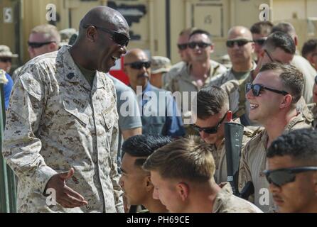 Sergeant Major of the Marine Corps Sgt. Maj. Ronald L. Green speaks with Marines before a town hall in Shorab, Afghanistan, June 28, 2018. Sgt. Maj. Green was there with Commandant of the Marine Corps Gen. Robert B. Neller to speak about the latest message to the force “Execute” and answer questions. Stock Photo