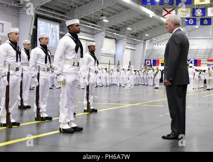 LAKES, Ill. (June 29, 2018) Secretary of the Navy Richard V. Spencer provides review remarks to the ceremonial honor guard at Midway Ceremonial Drill Hall during boot camp graduation at Recruit Training Command (RTC). Spencer served as the reviewing officer for the pass-in-review graduation ceremony where more than 650 recruits graduated from the Navy’s only boot camp. Spencer was making his second visit to RTC since being named secretary of the Navy on Aug. 3, 2017. About 38,000 to 40,000 recruits graduate annually from RTC. Stock Photo