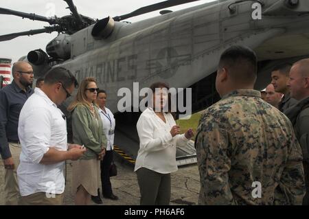 Karen Pence, the U.S. second lady, speaks with Marines with Special Purpose Marine Air-Ground Task Force - Southern Command before boarding a CH-53E Super Stallion helicopter at La Aurora International Airport in Guatemala City, Guatemala, June 28, 2018. Pence flew with Guatemalan first lady Patricia Morales to visit La Escuintla, an area damaged by volcanic eruptions by Fuego Volcano. Pence and her staff delivered care packages to families and assessed the total damage caused by the volcano that has affected the lives of millions in the area. The Marines and sailors of SPMAGTF-SC are conducti Stock Photo