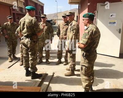 KABUL, Afghanistan (June 30, 2018) – Oklahoma Army National Guard Troopers with 1st Squadron, 180th Cavalry Regiment, 45th Infantry Brigade Combat Team, visit with Azerbaijani Soldiers at Hamid Karzai International Airport in Kabul, Afghanistan, June 30, 2018. The Oklahoma National Guard and Azerbaijan became partnered nations in 2002 under the National Guard Bureau’s State Partnership Program, a 25-year-old program connecting the National Guard with over 75 nations around the world. In this case, both nations are currently deployed to Afghanistan in support of the NATO-led train, advise and a Stock Photo