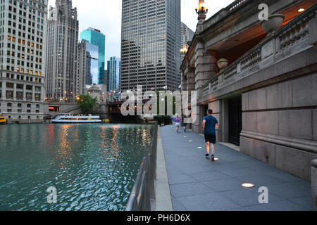 A runner in the early morning along Chicago's Riverwalk Stock Photo