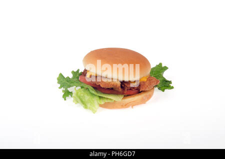 Chick-Fil-A Chicken fillet sandwich with lettuce, tomato and yellow cheese in a roll or bun on white background Stock Photo