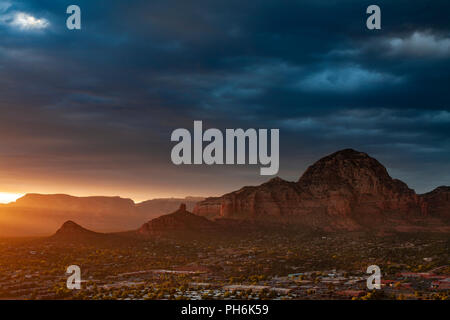 Sedona and surrounding sandstone buttes at sunset with clouds, Arizona, USA Stock Photo