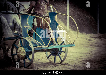 Roman chariot in a fight of gladiators, bloody circus Stock Photo