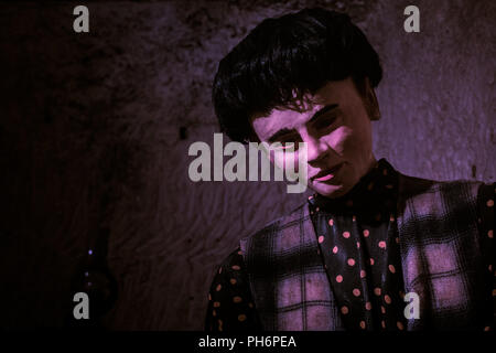 Close Up of Male Mannequin in Purple Light Stock Photo