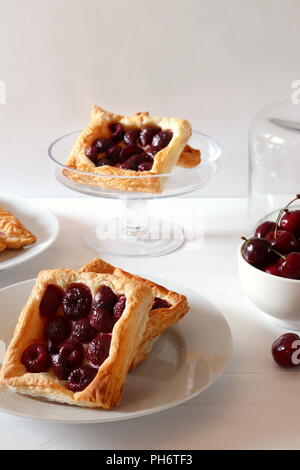 Freshly baked puff pastry squares with cherries Stock Photo