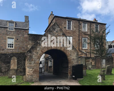 Ayr, Scotland, UK - August 29, 2018:  The entrance to the Auld Kirk dates from the 16th Century (1656) and is situated with its ancient graveyard in t Stock Photo