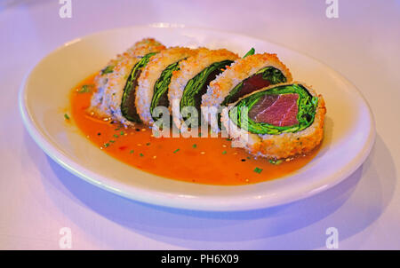 Deep fried panko crusted tuna and spinach sushi roll Stock Photo