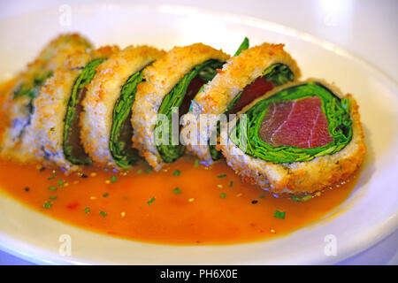 Deep fried panko crusted tuna and spinach sushi roll Stock Photo