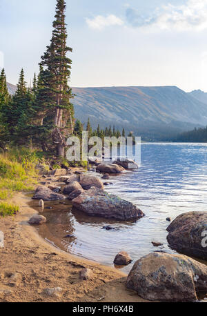 USA, Colorado, Rocky Mountains, Indian Peaks Wilderness. A hiker takes ...