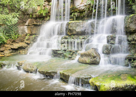 A beautiful waterfall in the Zilker Botanical Gardens on the shores of Lady Bird Lake near downtown Austin, Texas Stock Photo