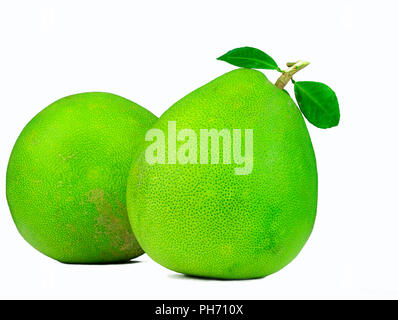 Two pomelo with leaves isolated on white background. Tropical fruit. Natural source of vitamin C and potassium. Healthy food for slow down aging. Food Stock Photo