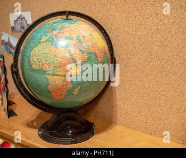 Rustic world globe displaying Africa and Europe in a child's room Stock Photo