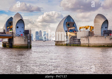 Thames Barrier, London, with Canary Wharf and the Millennium Dome in the background. Stock Photo