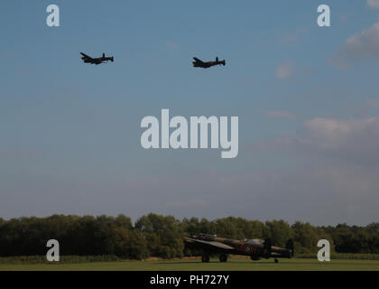 3 Lancaster bombers with engines running Stock Photo