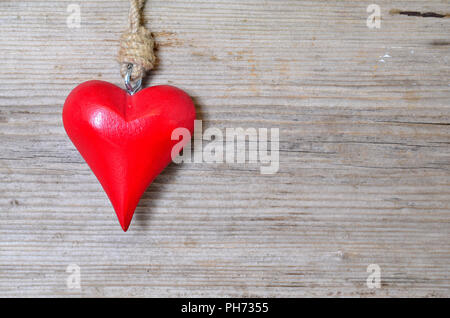 red heart on old wood background Stock Photo