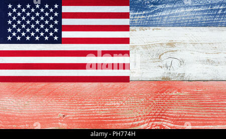 American flag with national colors painted on fading wooden boards Stock Photo