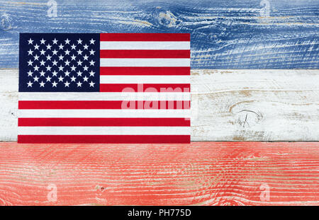 USA flag with national colors painted on fading wooden boards Stock Photo