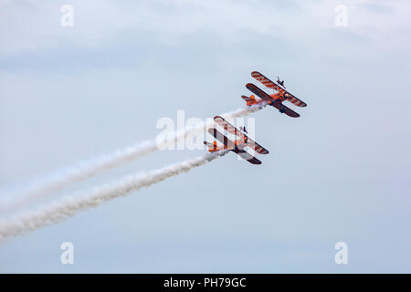 Bournemouth, UK. 30th August 2018. The Aero Superbatics Wingwalkers wing walkers perform at the 11th annual Bournemouth Air Festival - the Flying Circus. Perfect weather for flying. Credit: Carolyn Jenkins/Alamy Live News Stock Photo