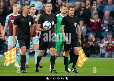 Burnley, UK. 30th August 2018. Referee Viktor Kassai leads the teams out  30th August 2018, Turf Moor, Burnley, England; UEFA Europa League, Play off leg 2 of 2, Burnley v Olympiacos FC Credit: Terry Donnelly/Alamy Live News Stock Photo