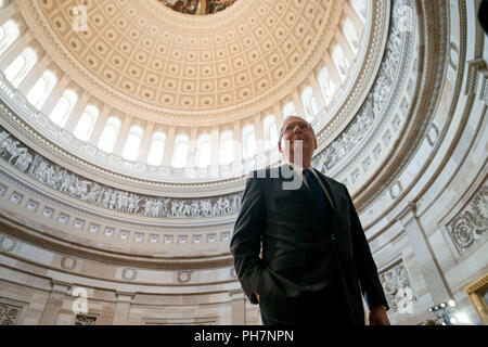 Senate Majority Leader Mitch McConnell of Ky., walks through the Rotunda before the casket of Sen. John McCain, R-Ariz., lies in state at the U.S. Capitol, Friday, Aug. 31, 2018, in Washington. (AP Photo/Andrew Harnik, Pool) | usage worldwide Stock Photo