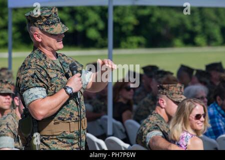 U.S. Marine Corps Lt. Col. Jonathan T. Baker, 2nd Transportation Support Battalion commanding officer, speaks during a change of command ceremony on Camp Lejeune, N.C., June 28, 2018. During the ceremony, Lt. Col. John S. Sattely relinquished command of 2nd TSB to Baker. Stock Photo