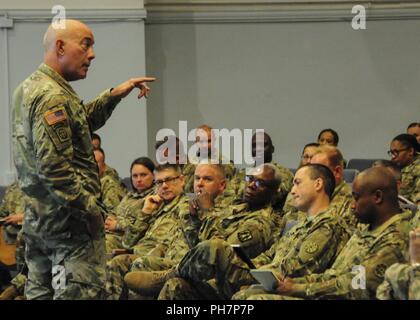 Lt. Gen. Charles Luckey, the Chief of Army Reserve and Commanding General of the United States Army Reserve Command, talks with participants be part of his briefing, during the first Regional Warrant Officer Training and Recruiting Workshop at the Timmerman Conference Center, June 30. “I want [you] the warrant officers, to use your experiences to enable the team,” said Luckey. Stock Photo