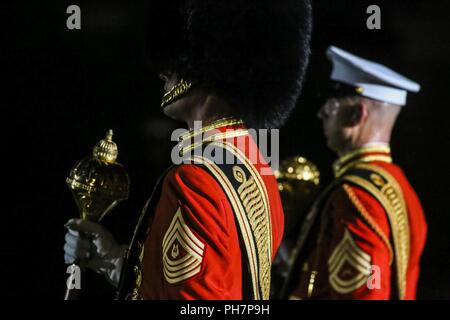 Master Gunnery Sgt. Duane F. King, left, drum major, “The President’s Own” U.S. Marine Band, and Gunnery Sgt. Josh Dannemiller, assistant drum major, “The Commandant’s Own,” U.S. Marine Drum & Bugle Corps, march across the parade deck during a Friday Evening Parade at Marine Barracks Washington D.C., June 29, 2018. The guest of honor for the ceremony was the Under Secretary of the Navy, Thomas B. Modly, and the hosting official was the Assistant Commandant of the Marine Corps, Gen. Glenn M. Walters. Stock Photo