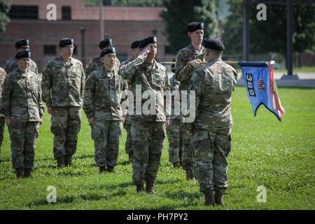 Soldiers with the 389th U.S. Army Materiel Command Band stand prepare to case the colors during their inactivation ceremony, at Redstone Arsenal, June 29, 2018. Since relocating to Redstone Arsenal from Aberdeen Proving Ground, Maryland, in 2011, the AMC band has performed more than 2,700 times, at more than 60 locations around the world in support of the AMC enterprise, the Redstone Arsenal Garrison, and military and civilian functions. Stock Photo