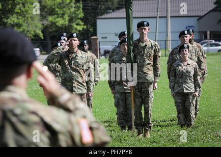 Soldiers with the 389th U.S. Army Materiel Command Band stand at attention during their inactivation ceremony, at Redstone Arsenal, June 29, 2018. Since relocating to Redstone Arsenal from Aberdeen Proving Ground, Maryland, in 2011, the AMC band has performed more than 2,700 times, at more than 60 locations around the world in support of the AMC enterprise, the Redstone Arsenal Garrison, and military and civilian functions. Stock Photo