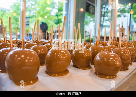 Batch of delicious homemade Caramel Apples on a plate. Stock Photo