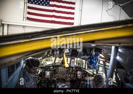 179th Airlift Wing Maintenance members work on a C-130H Hercules, June 20, 2018.  The Airmen have inspected and maintenance the aircraft to keep it flying. Stock Photo