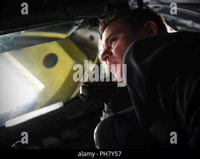 Sen. Todd Young learned about inflight refueling equipment that connects a KC-135R Stratotanker to receiver during his hands-on tour of Grissom Air Reserve Base, Ind., June 15, 2018. Young, a Marine veteran, met with Hoosier Airmen to learn about Grissom’s operational capabilities. Stock Photo