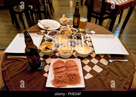 Horizontal view of all the dishes composing a Sri Lanka curry. Stock Photo