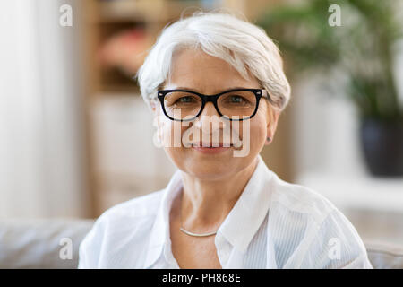portrait of happy senior woman in glasses Stock Photo