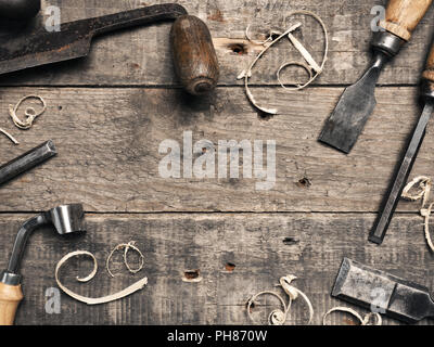 Carpenter tools on a rustic wooden background with space for text Stock Photo
