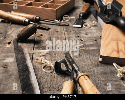 Carpenter tools on a rustic wooden background with space for text Stock Photo
