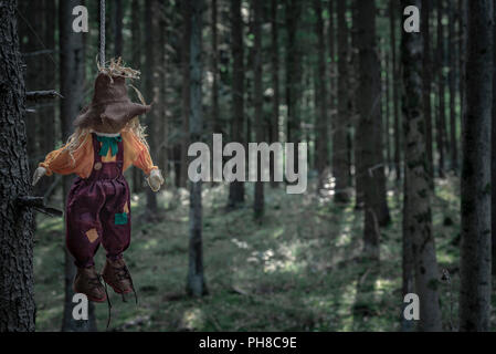Hanging Rope Creepy Scary scenery with a shabby scarecrow tied to a tree branch with a rope ...