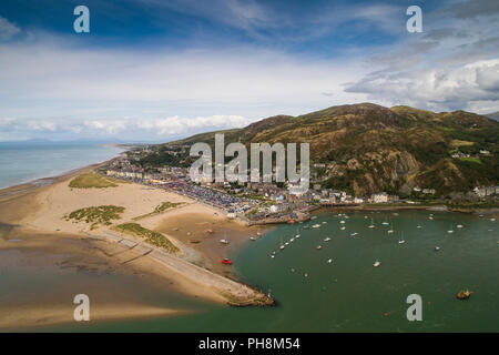 An aerial drone view of Barmouth (Y Bermo / Abermaw in welsh) - a small welsh town and seaside resort on the  mouth of the Mawddach  estuary, Gwynedd, Snowdonia National Park, North Wales UK (made by a CCA licenced and insured drone operator) Stock Photo