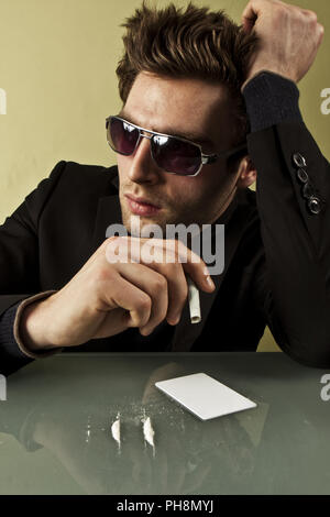 Problem of drugs. The person using cocaine. Photo. Stock Photo
